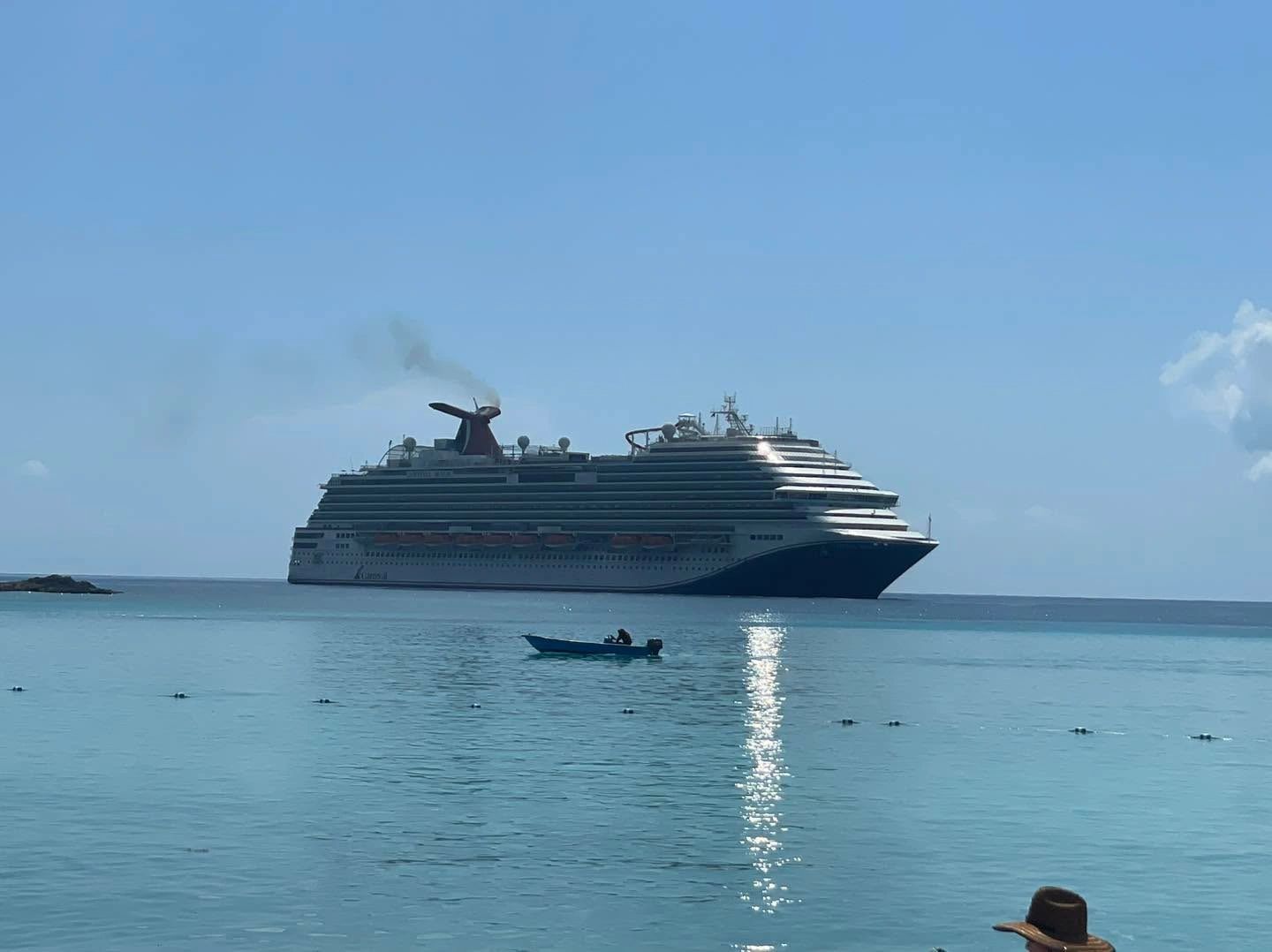 Cruise ship anchored in turquoise tropical waters