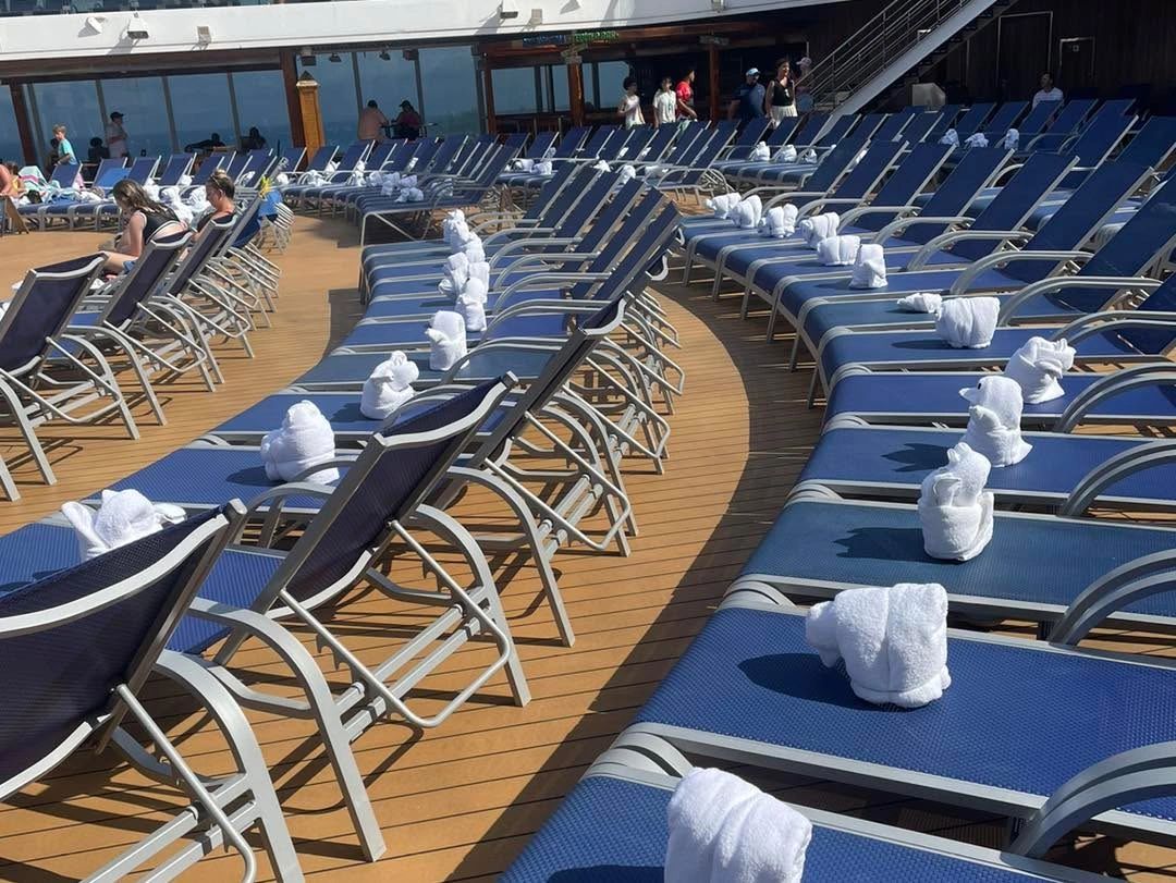 Cruise ship pool deck with lounge chairs