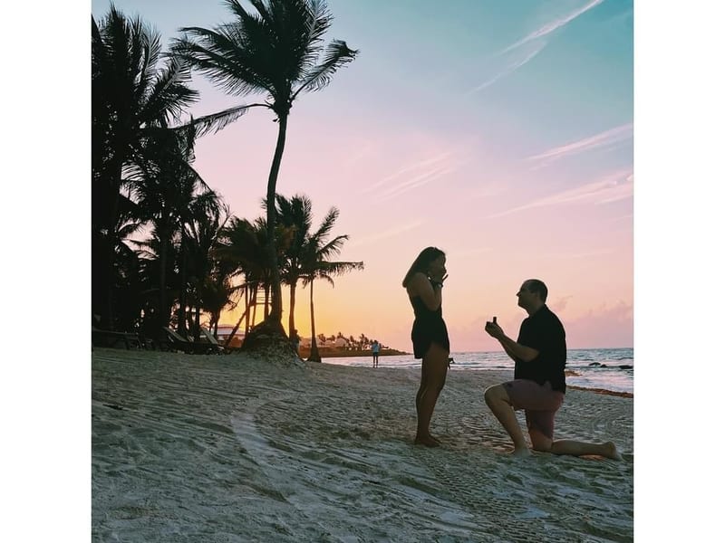 Couple celebrating a destination wedding on a tropical beach